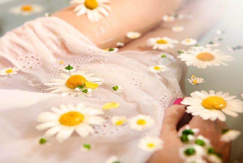 Person in Water with Flowers