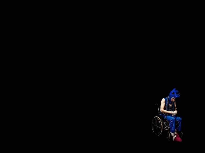 person in wheelchair with blue costume