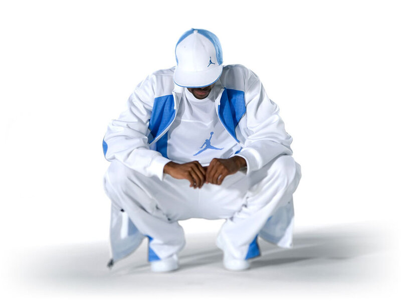 person in white and blue tracksuit
