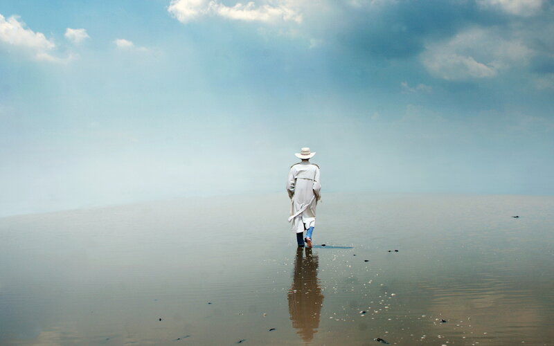 Person in White Coat — Blue
