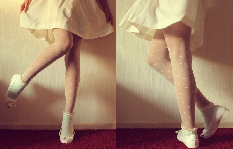 person in white dress and heart tights