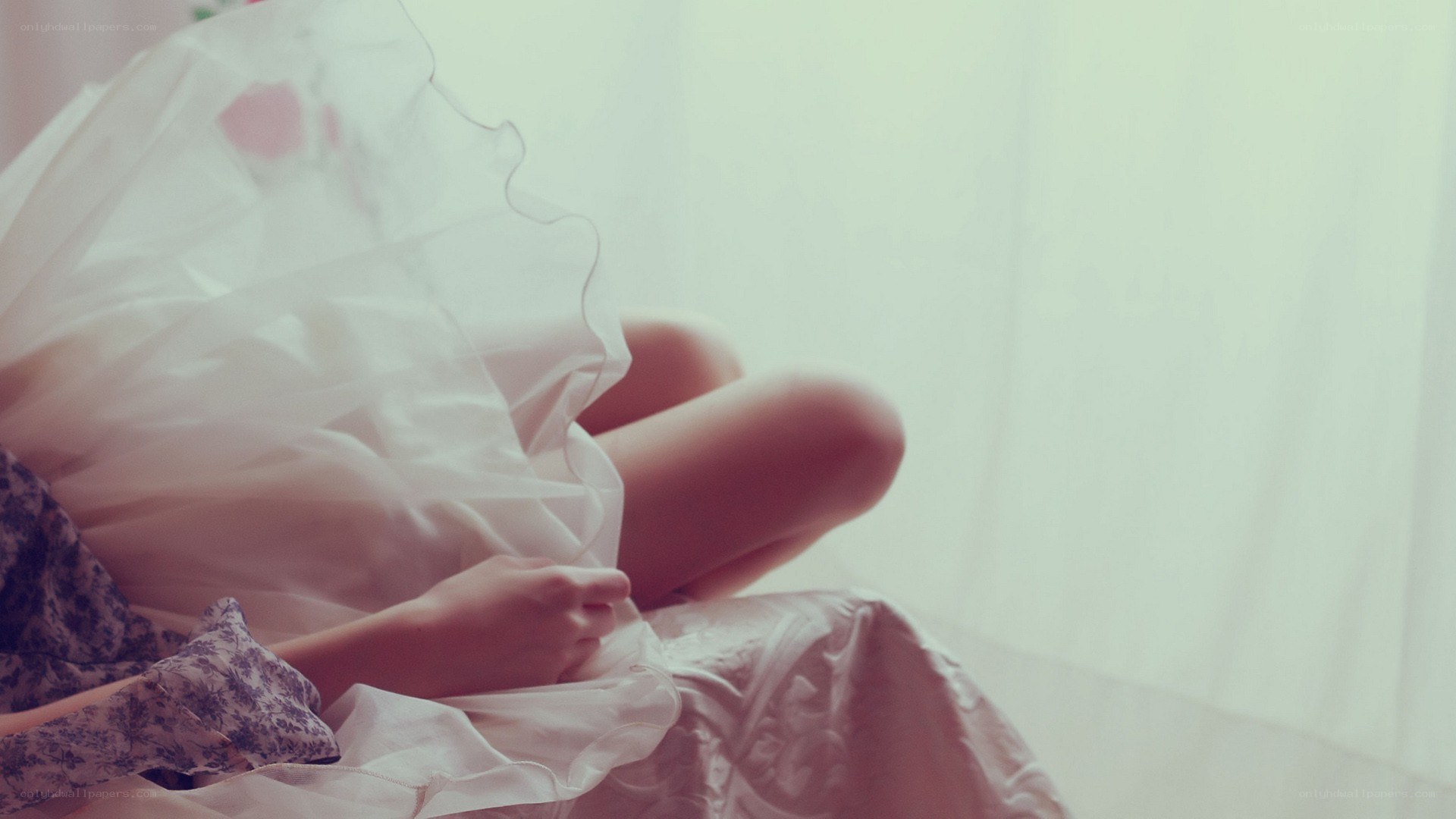 person in white dress sitting
