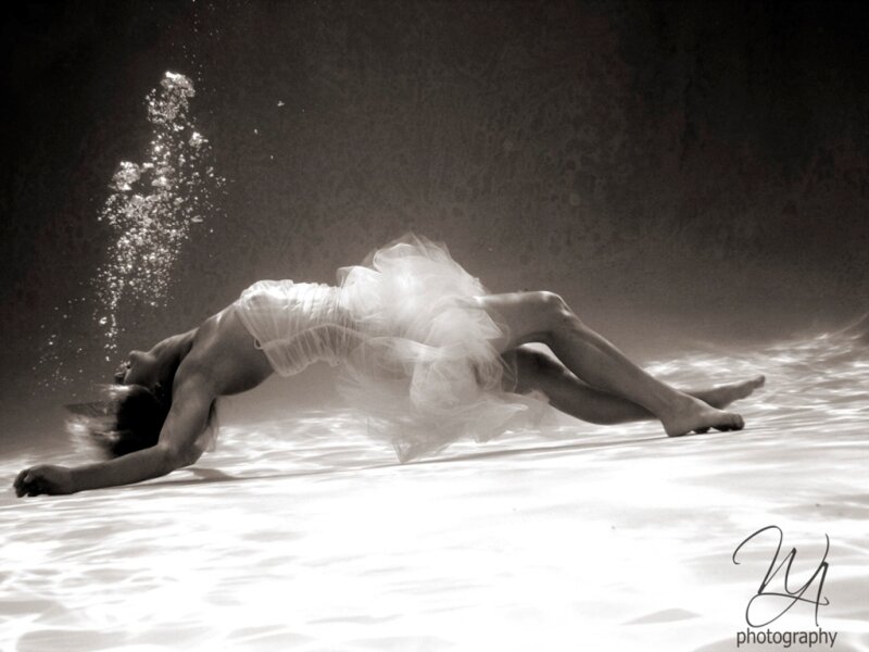 Person in White Dress Underwater