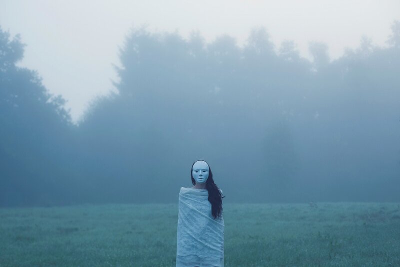 Person in White Mask — Blue, Mysterious