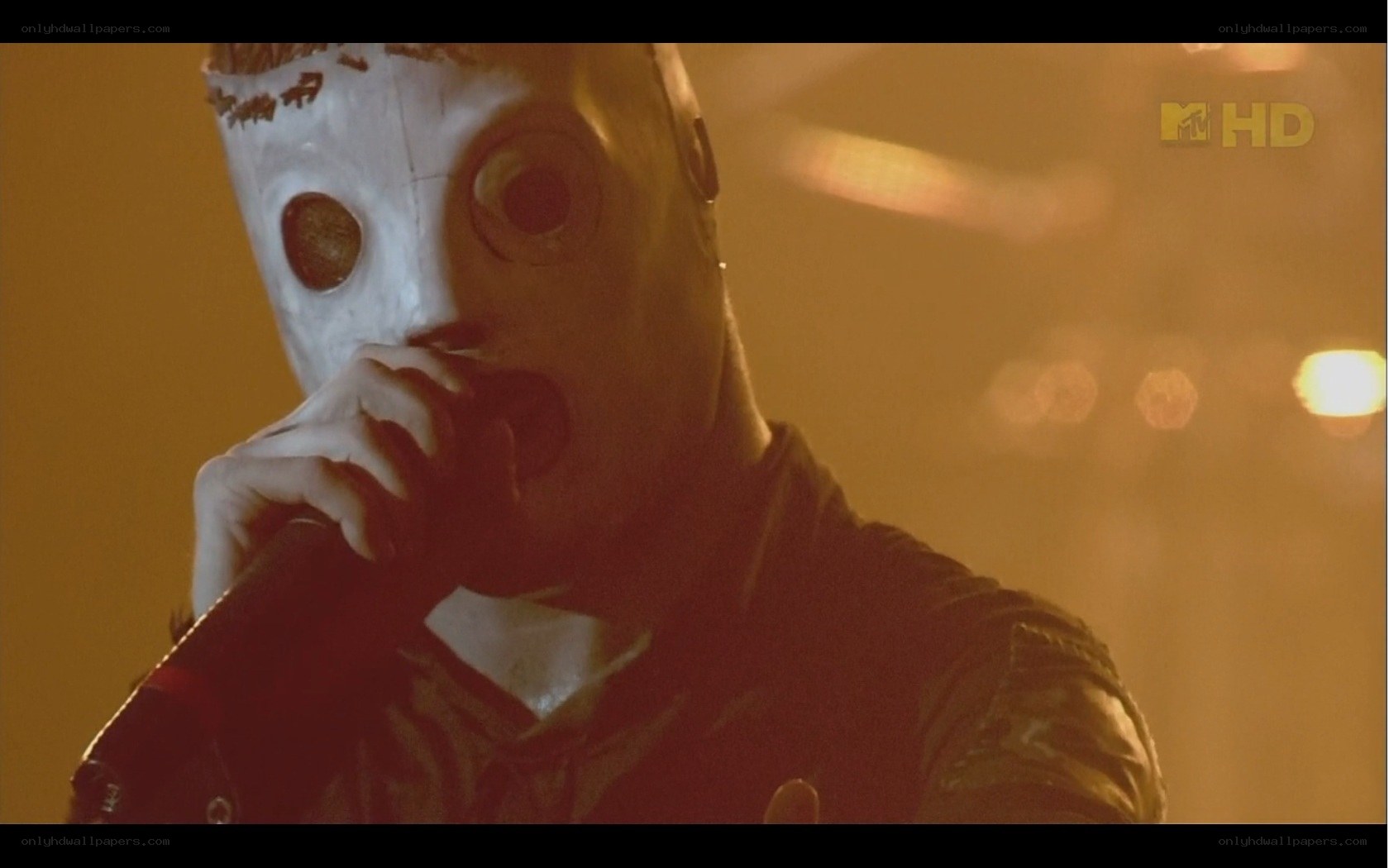 person in white mask singing