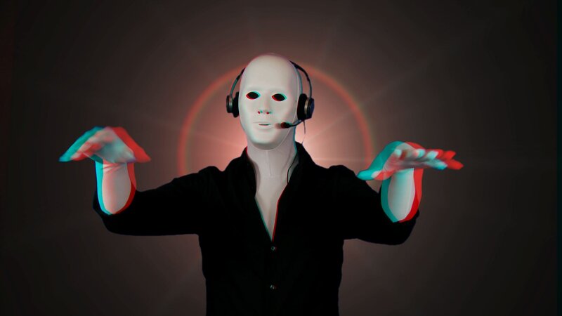 person in white mask with headphones