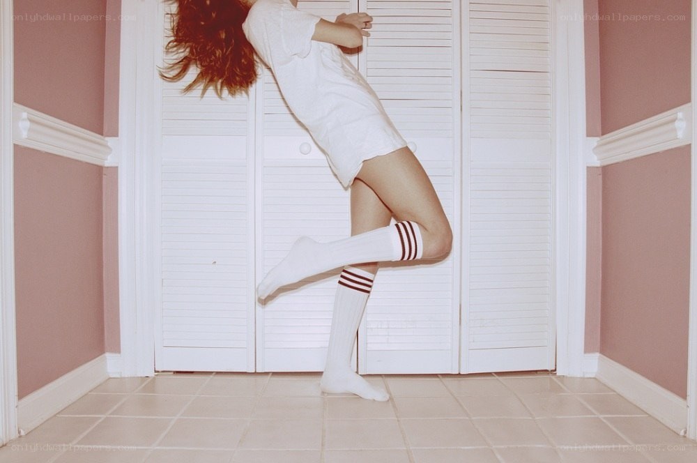 person in white outfit dancing