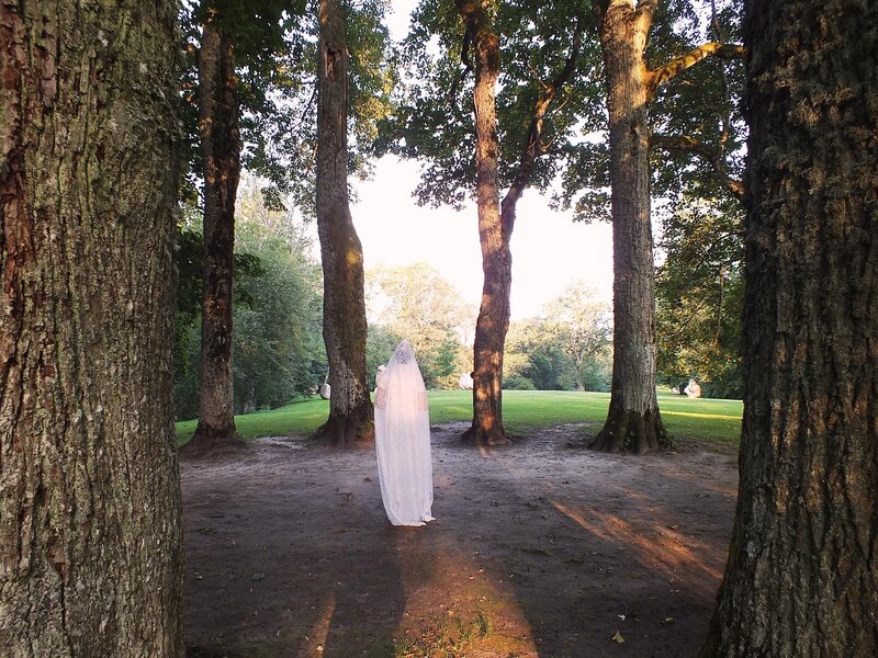 Person in White Robe — Green, Serene, Afternoon, Photograph