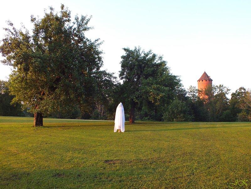 Person in White Sheet