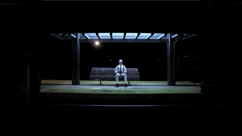 Person in White Suit — Black