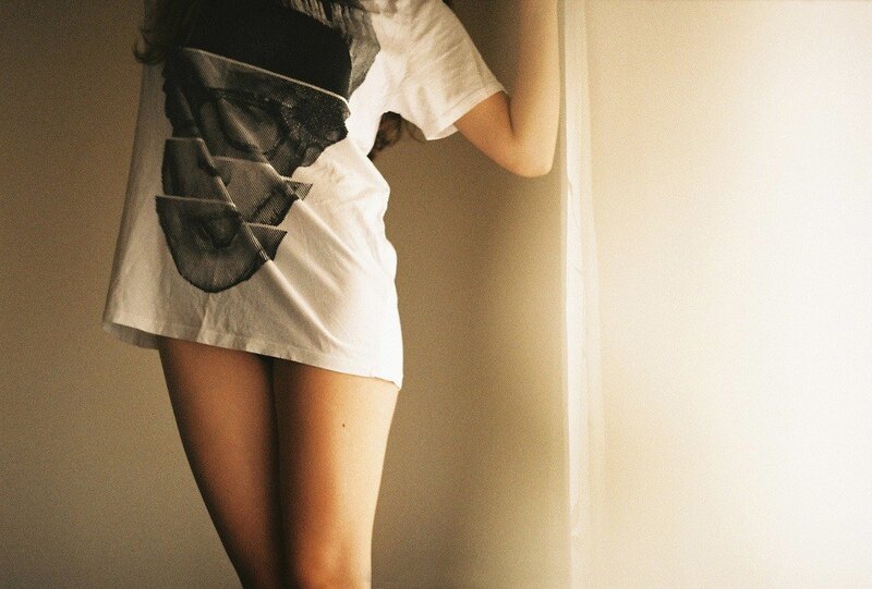 person in white t-shirt standing