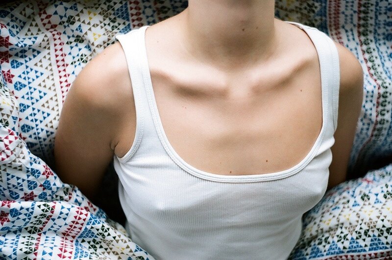 person in white tank top