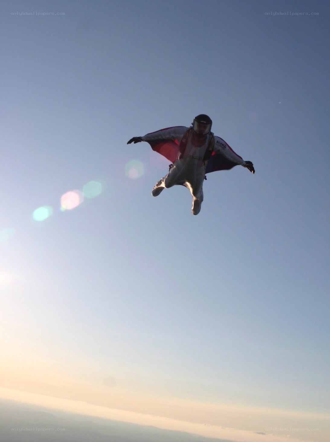 person in wingsuit flying