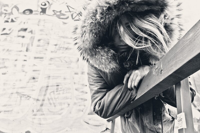 person in winter coat with fur hood