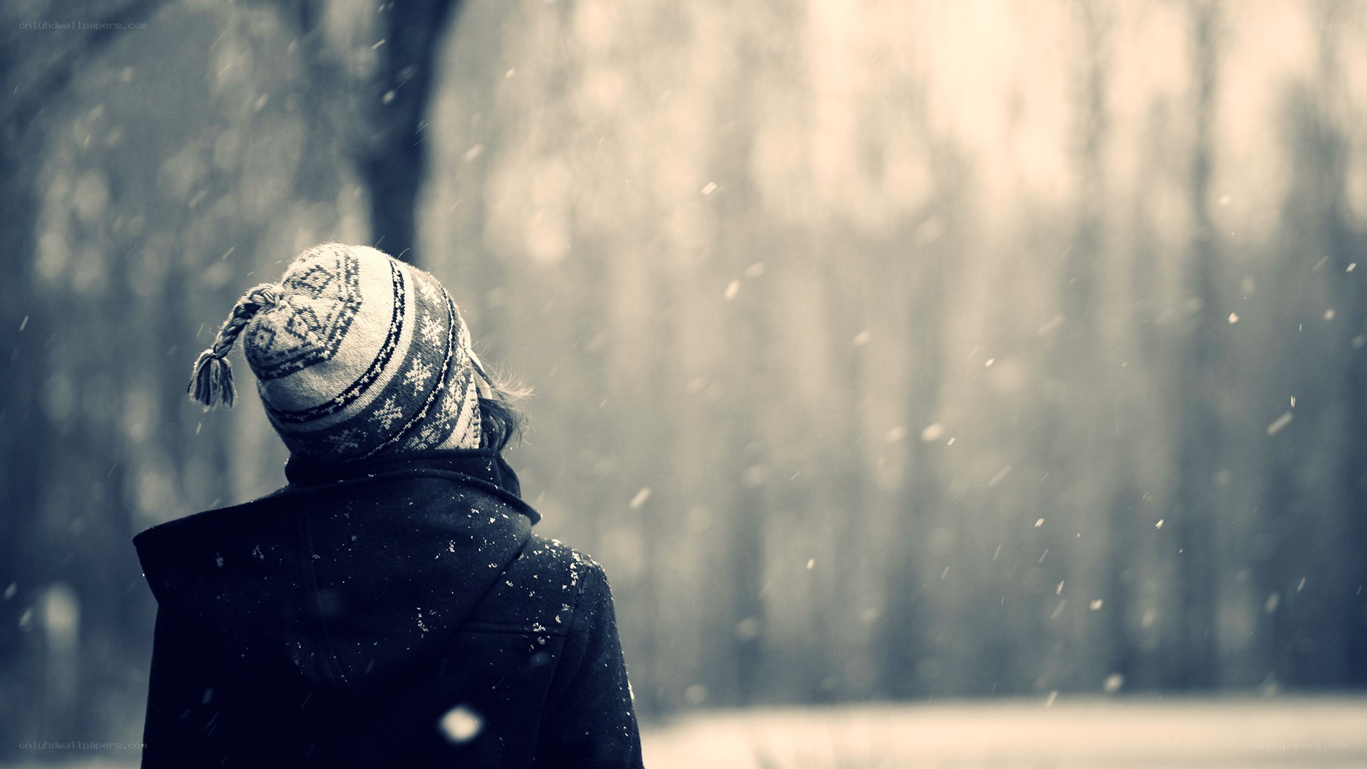 person in winter hat looking away