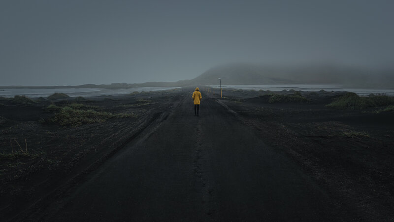 Person in Yellow Coat — Black