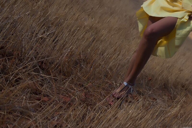 person in yellow dress walking