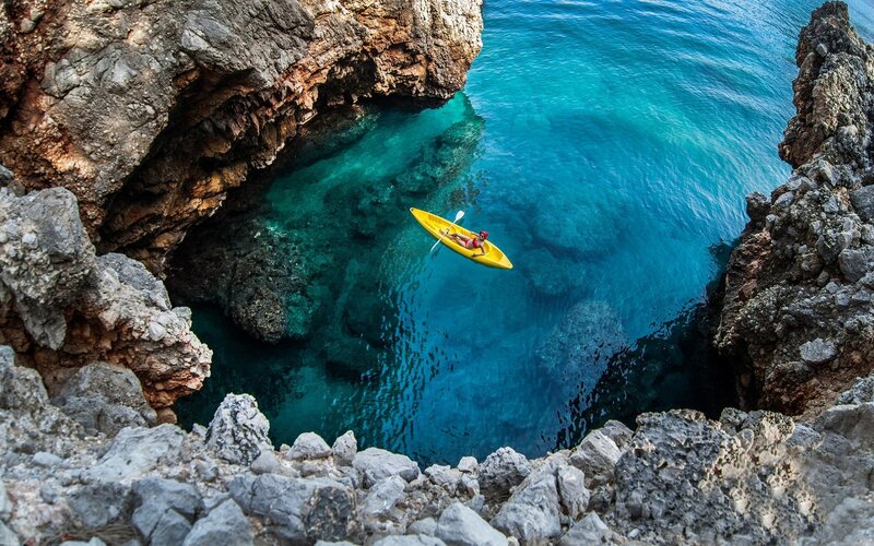 Person in Yellow Kayak — Blue