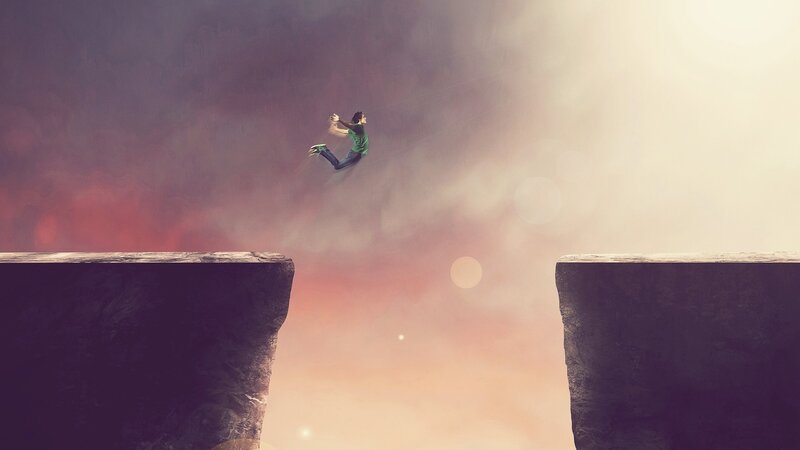 Person Jumping Across Chasm
