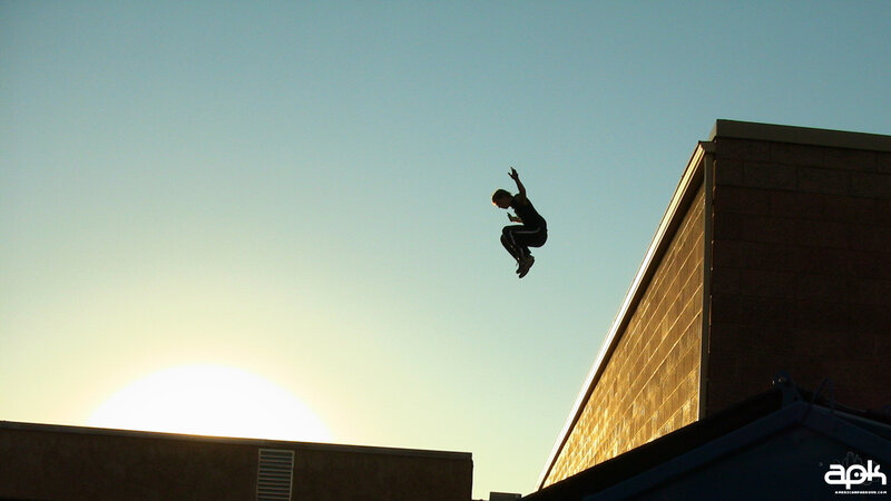 Person Jumping Between Buildings — Blue