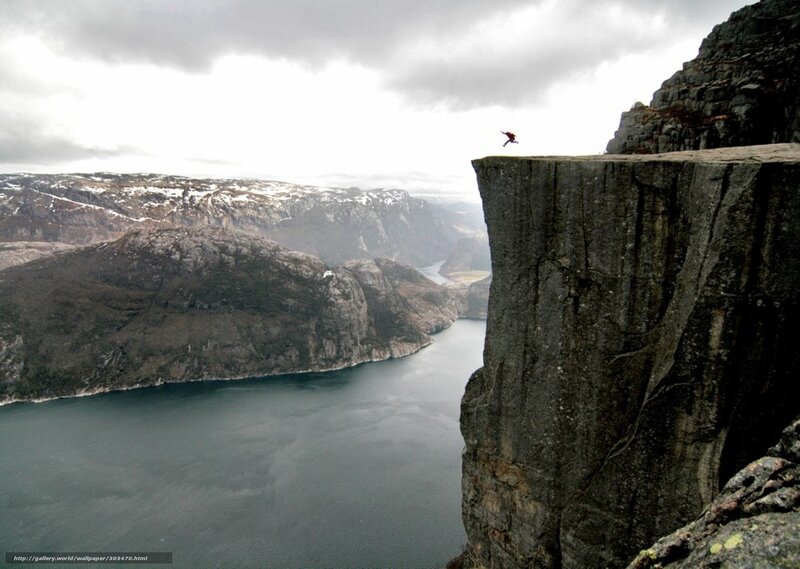 Person Jumping from Cliff — Gray