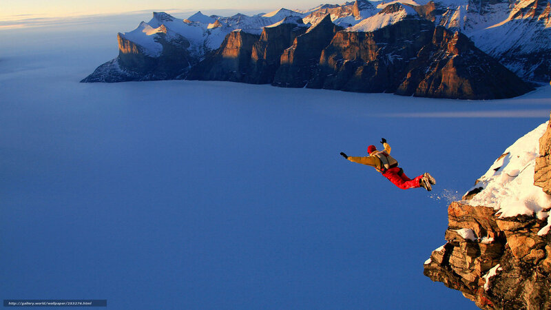 person jumping from cliff