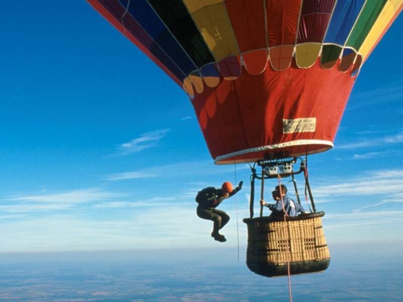 Person Jumping from Hot Air Balloon