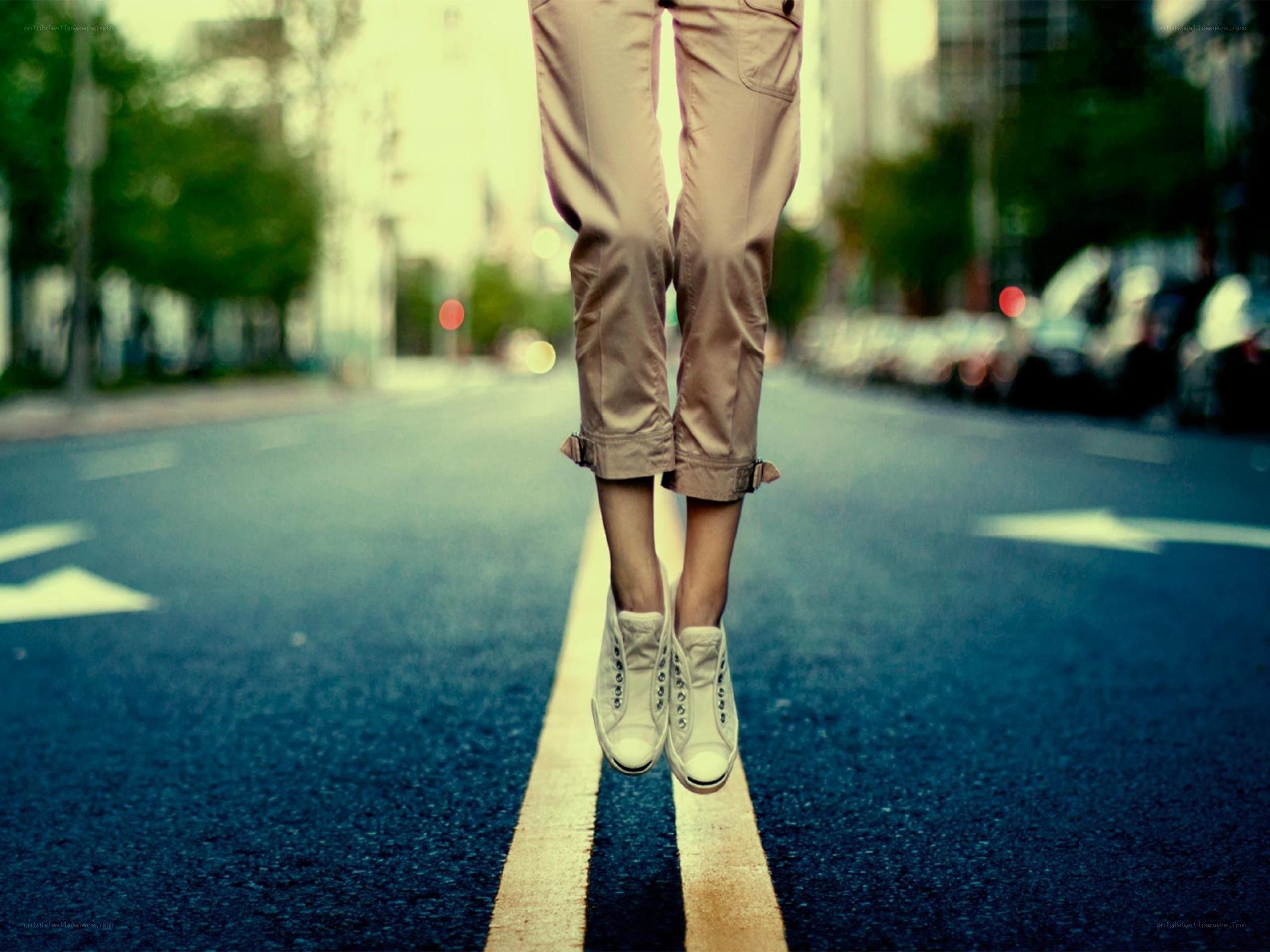 Person jumping on a road