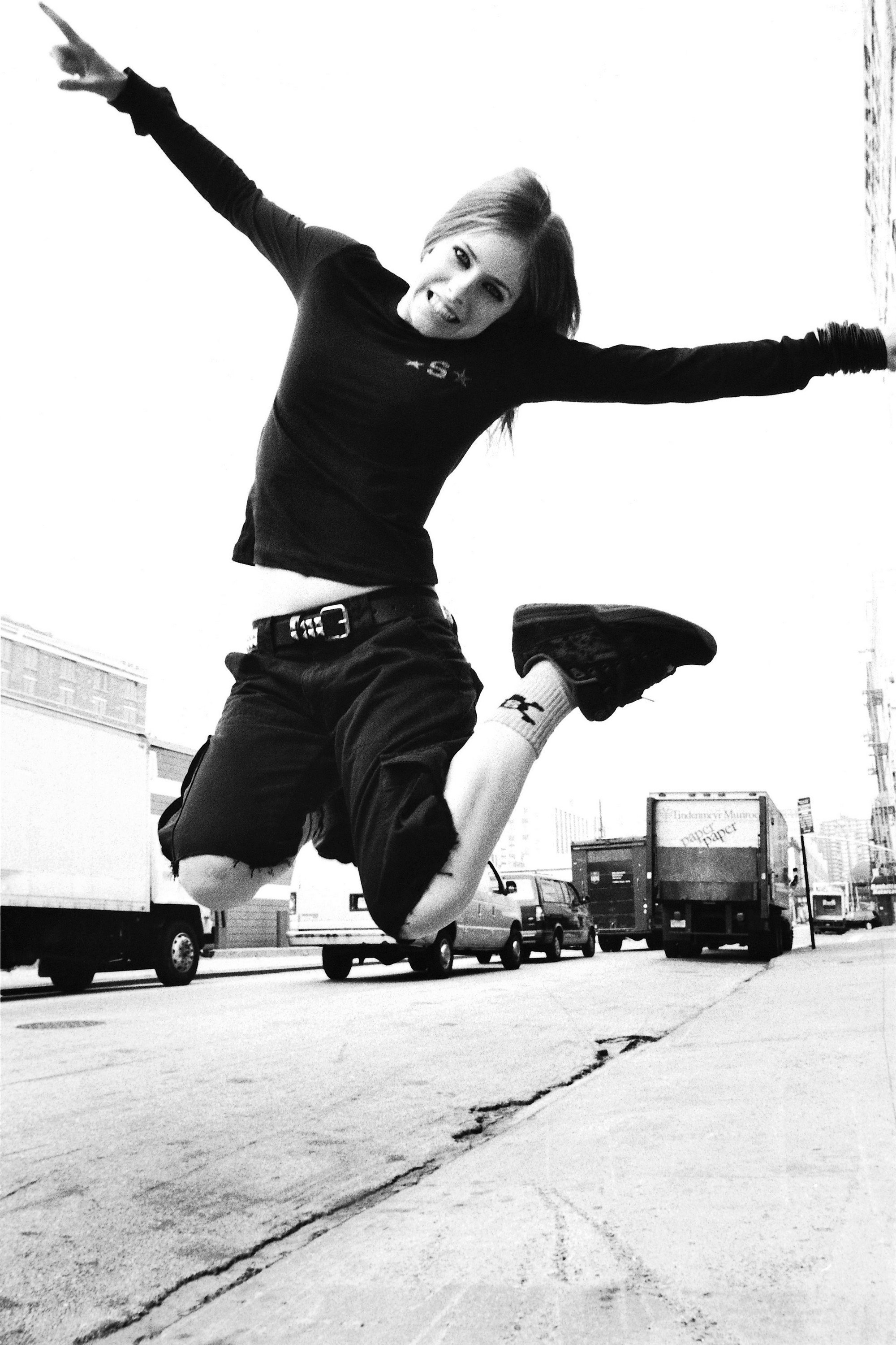 person jumping on street