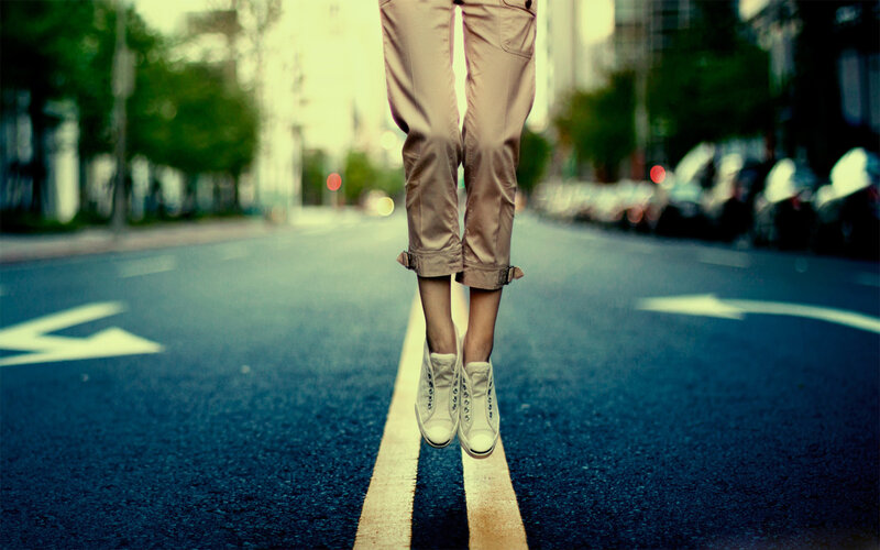 Person Jumping on Street — Blue