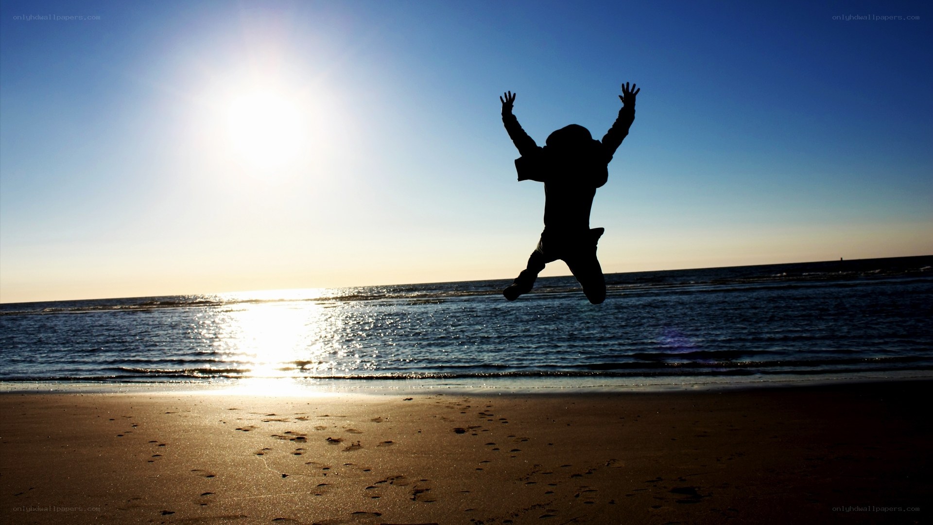 Person jumping on the beach
