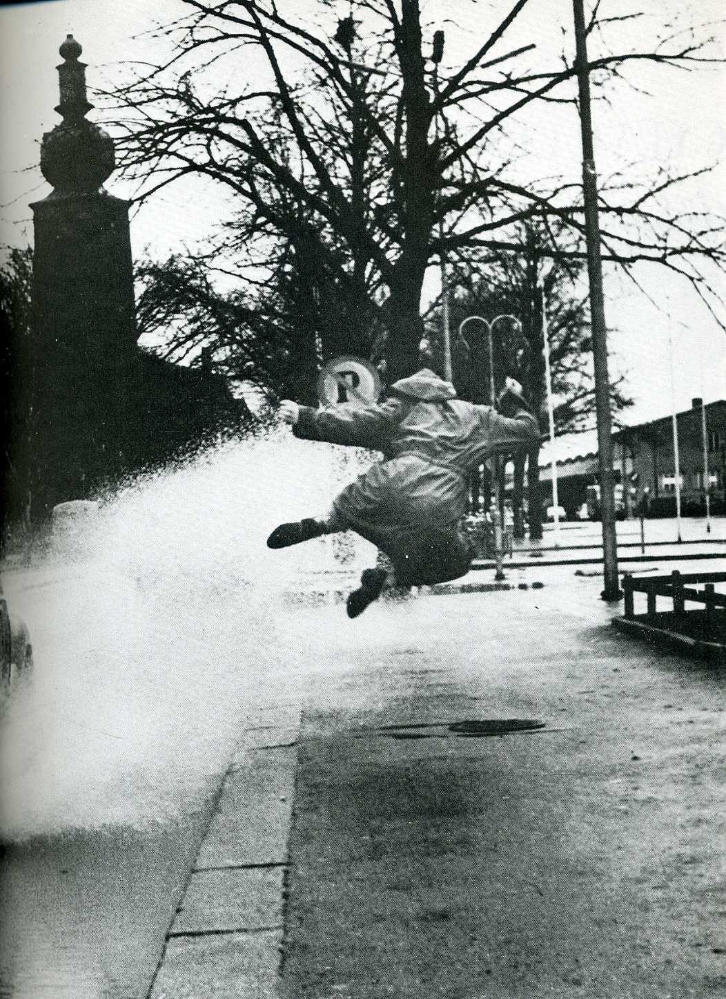 Person jumping over water splash