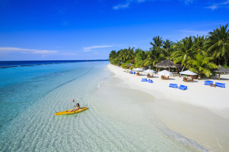 Person Kayaking in Ocean — Blue