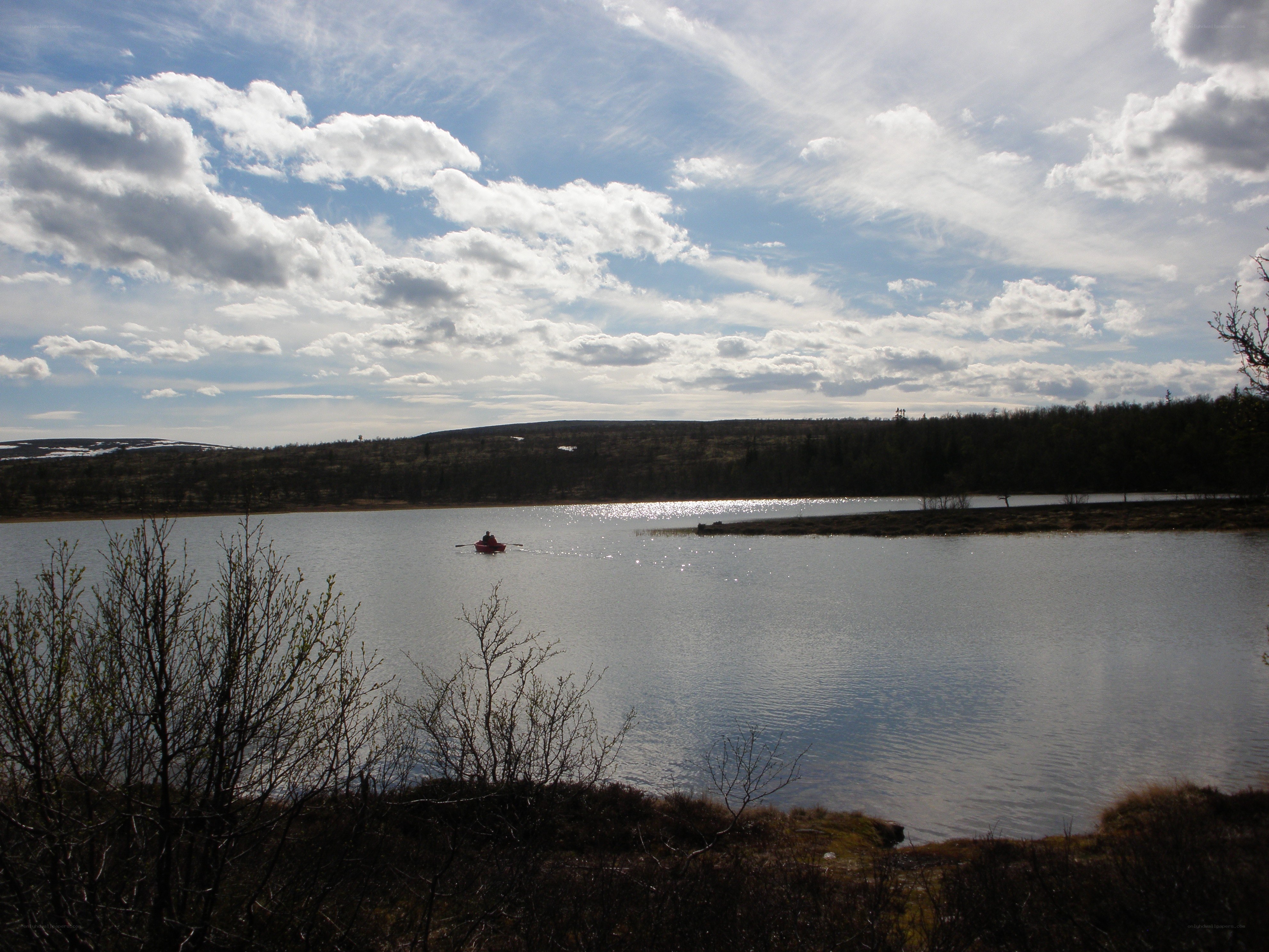 Person kayaking on a lake