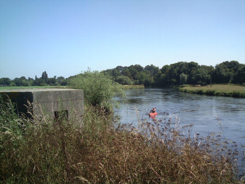 Person Kayaking on River