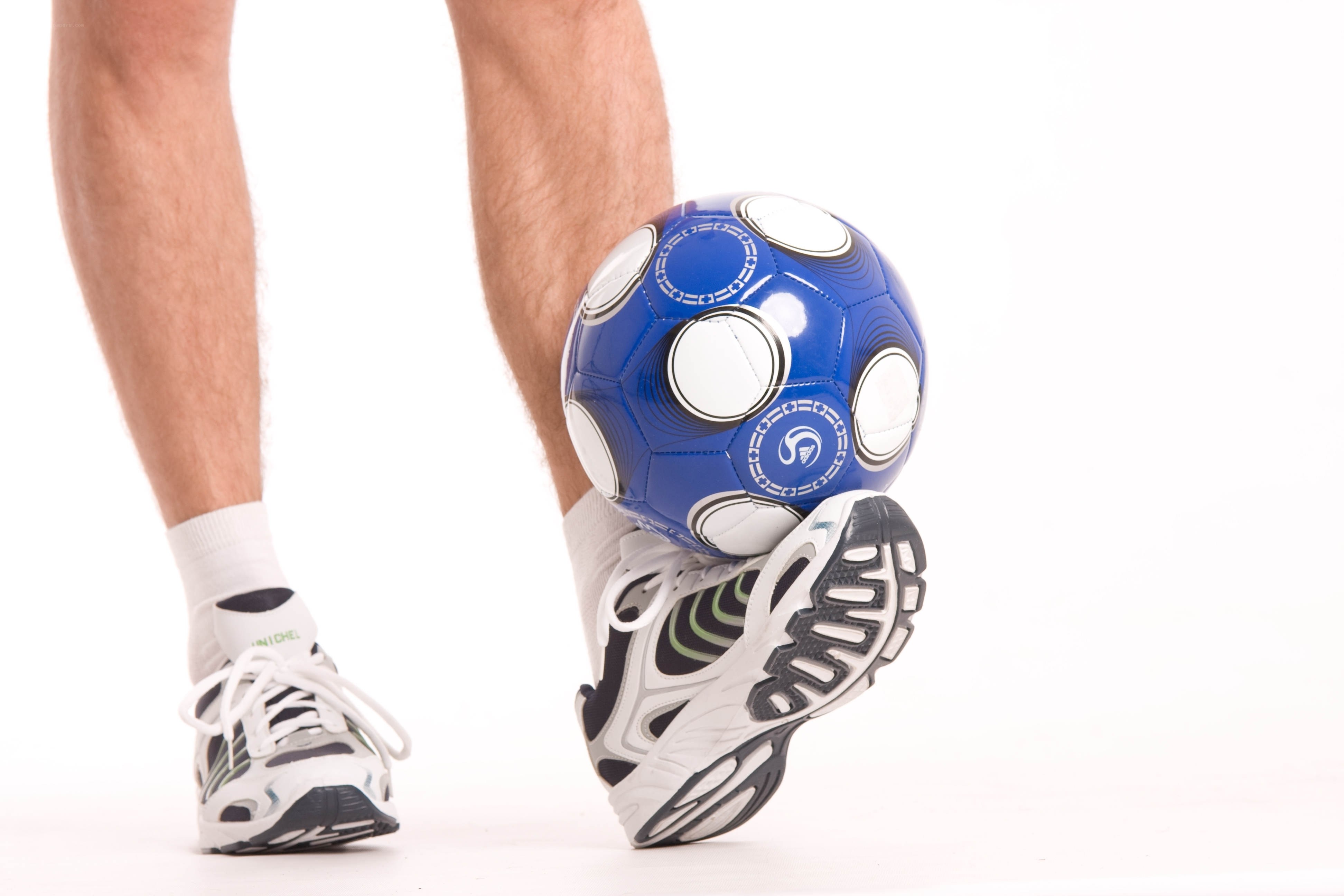 person kicking a soccer ball