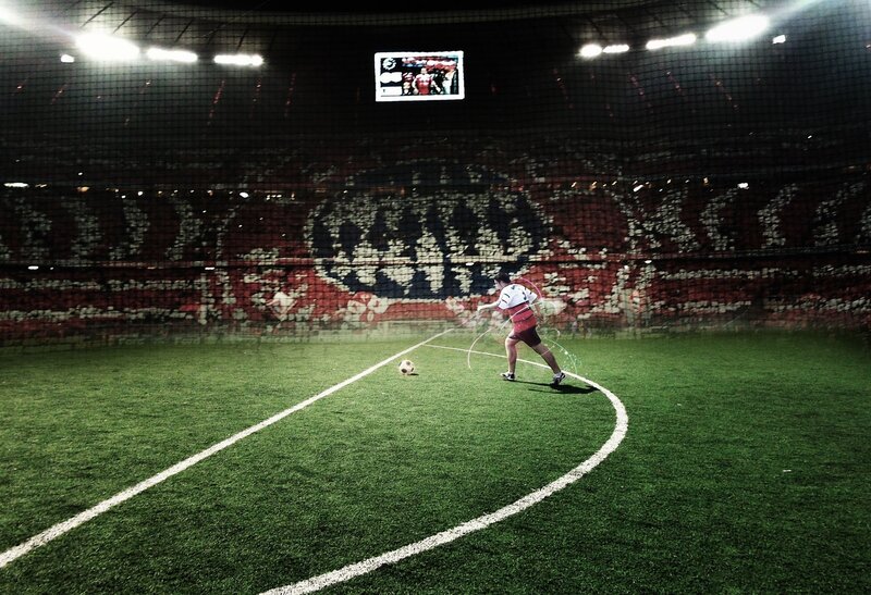 Person Kicking Soccer Ball