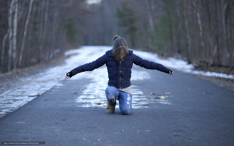 Person Kneeling on Road