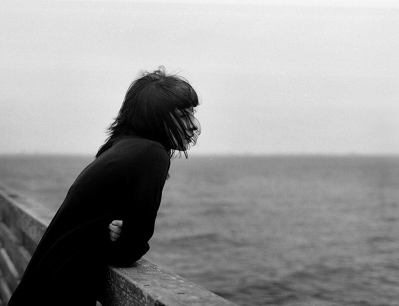 Person Leaning on Railing