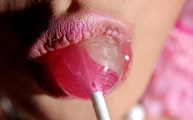 Person Licking Lollipop