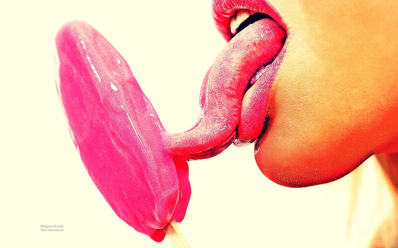 person licking pink ice cream
