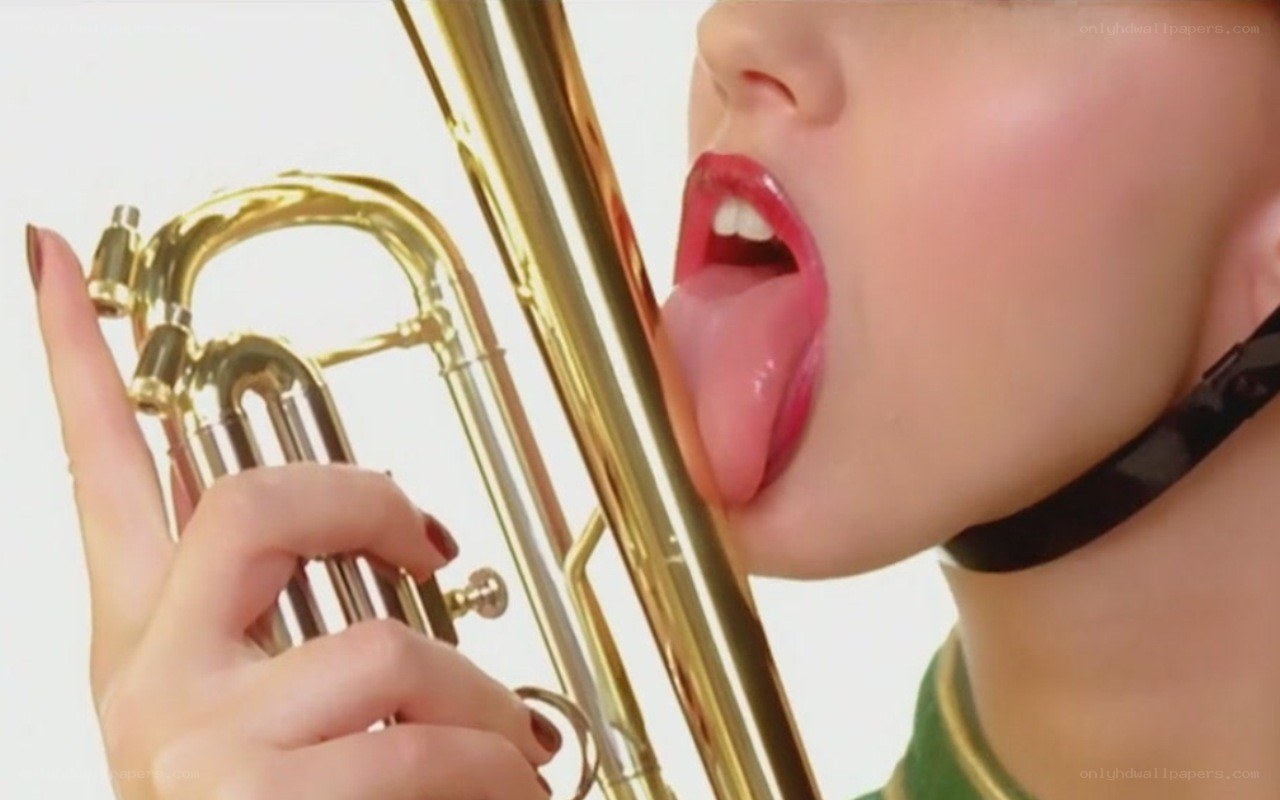 person licking trumpet