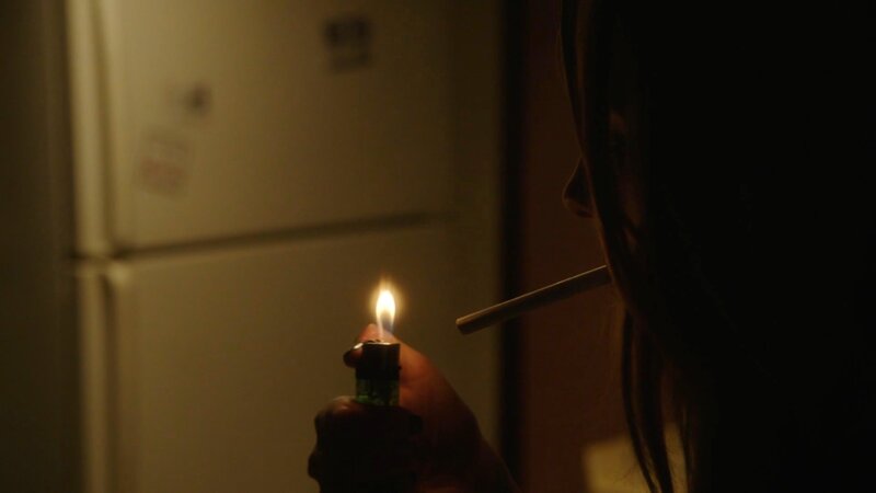 Person Lighting a Cigarette — Black