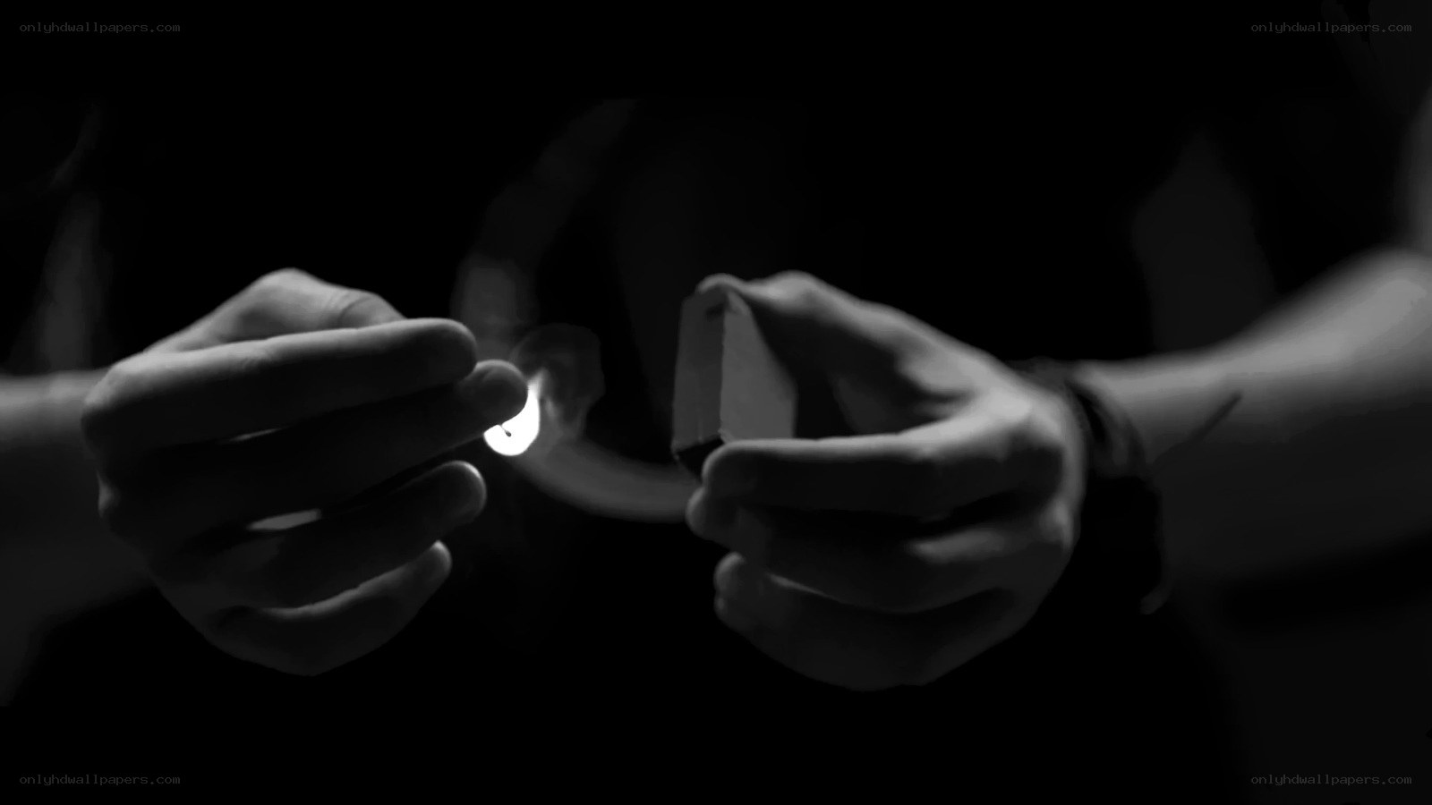 person lighting a match