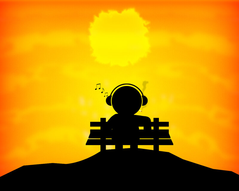 person listening to music at sunset