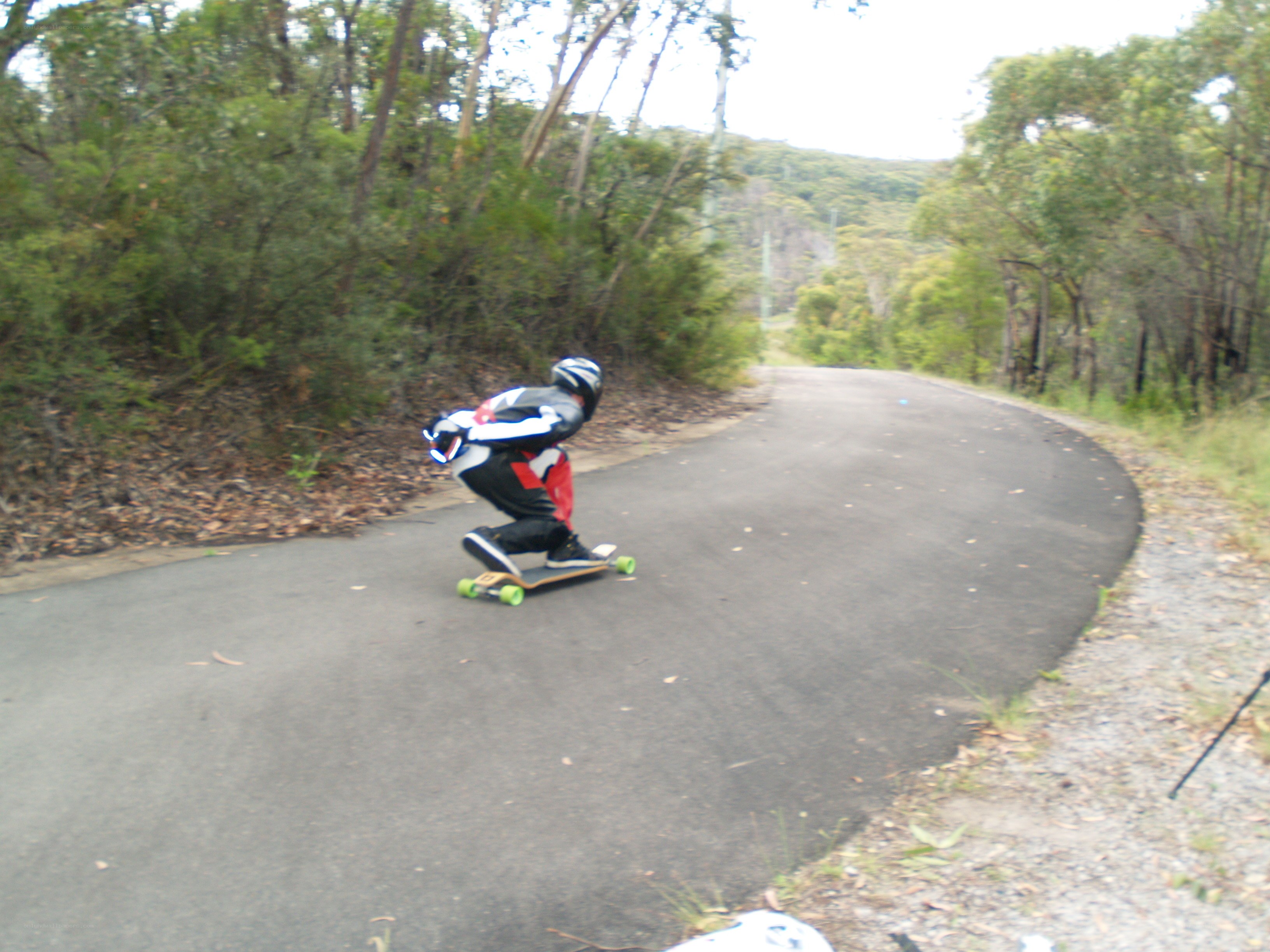 person longboarding on a road