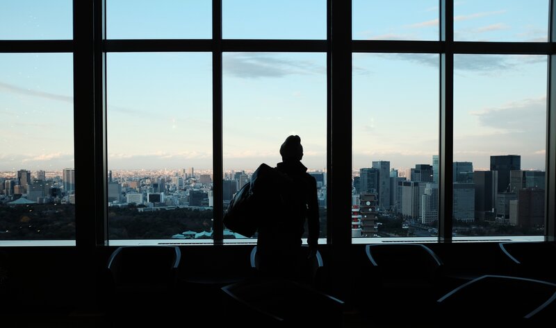 Person looking out at city