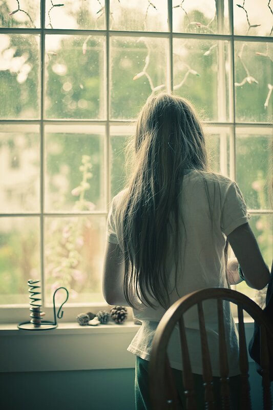 person looking out window