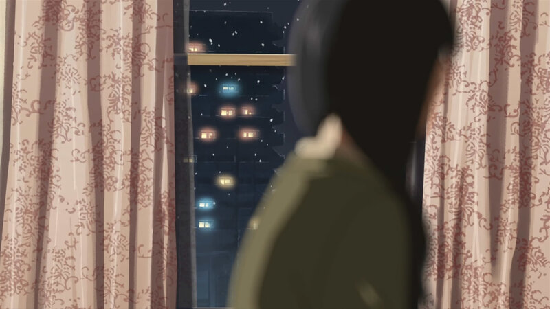 person looking out window at night