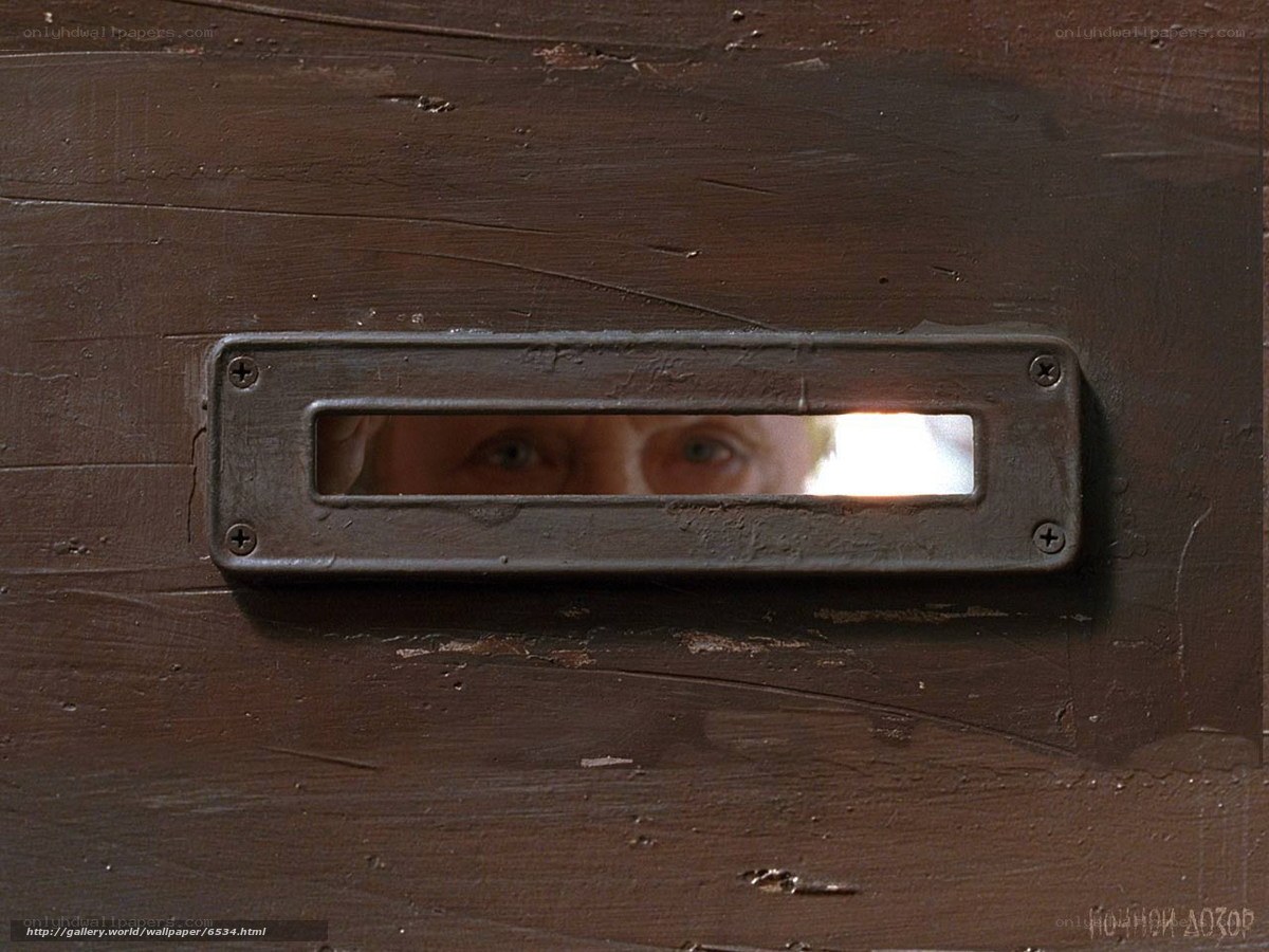 person looking through mail slot